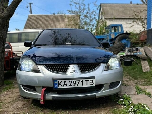 Синій Міцубісі Lancer, об'ємом двигуна 1.58 л та пробігом 300 тис. км за 2100 $, фото 1 на Automoto.ua