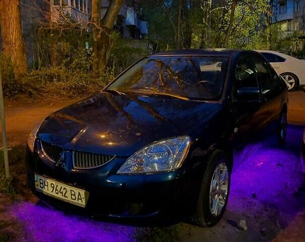 Синий Мицубиси Лансер, объемом двигателя 1.58 л и пробегом 386 тыс. км за 4200 $, фото 1 на Automoto.ua