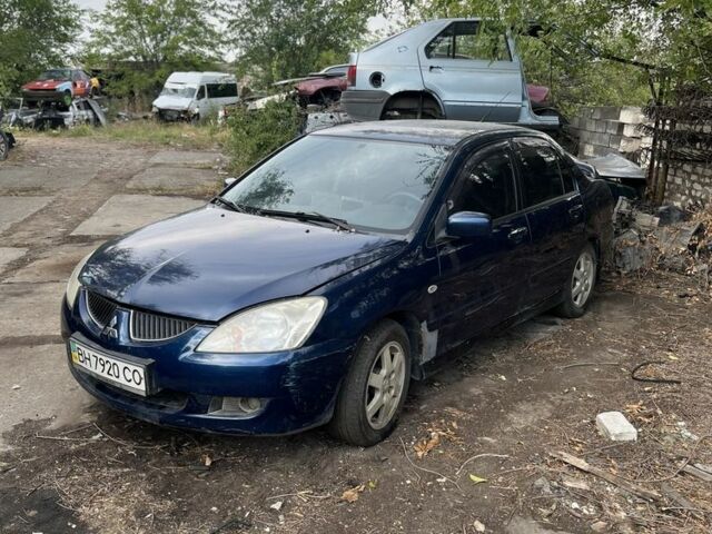 Синій Міцубісі Lancer, об'ємом двигуна 1.6 л та пробігом 200 тис. км за 1199 $, фото 1 на Automoto.ua