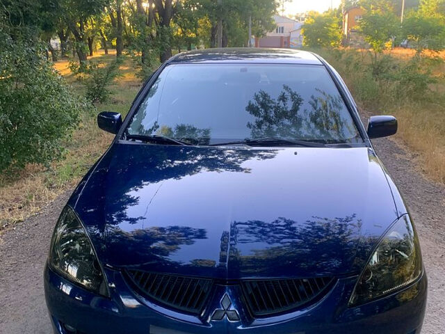 Синий Мицубиси Лансер, объемом двигателя 1.6 л и пробегом 295 тыс. км за 4550 $, фото 1 на Automoto.ua