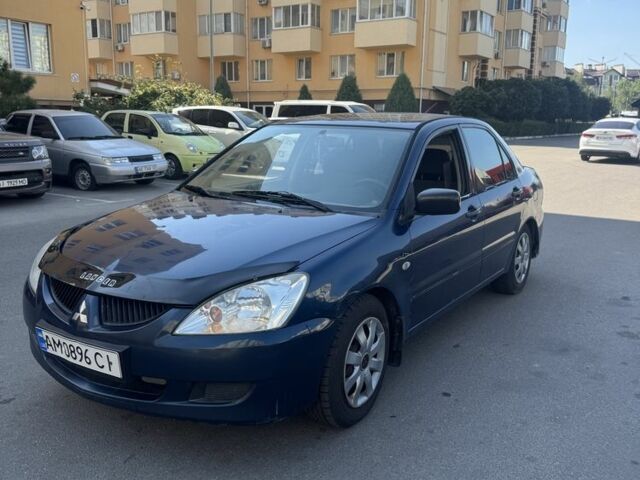 Синій Міцубісі Lancer, об'ємом двигуна 1.6 л та пробігом 270 тис. км за 2411 $, фото 1 на Automoto.ua