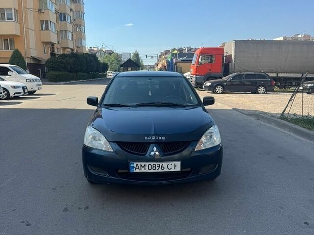 Синий Мицубиси Лансер, объемом двигателя 1.58 л и пробегом 270 тыс. км за 2400 $, фото 1 на Automoto.ua