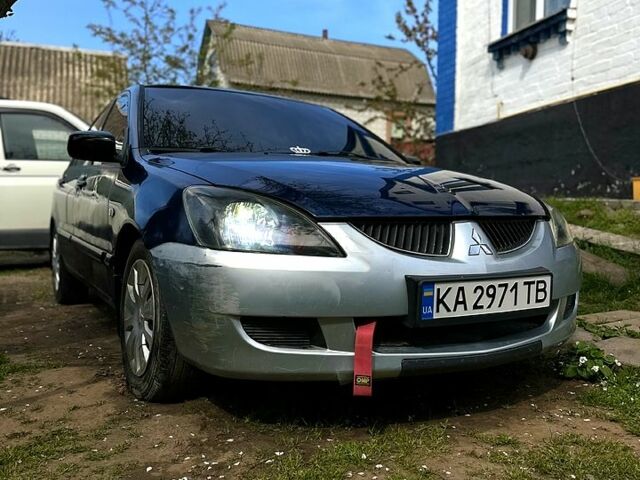 Синий Мицубиси Лансер, объемом двигателя 1.6 л и пробегом 300 тыс. км за 3300 $, фото 1 на Automoto.ua