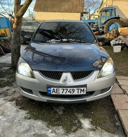 Синий Мицубиси Лансер, объемом двигателя 1.58 л и пробегом 260 тыс. км за 2400 $, фото 1 на Automoto.ua