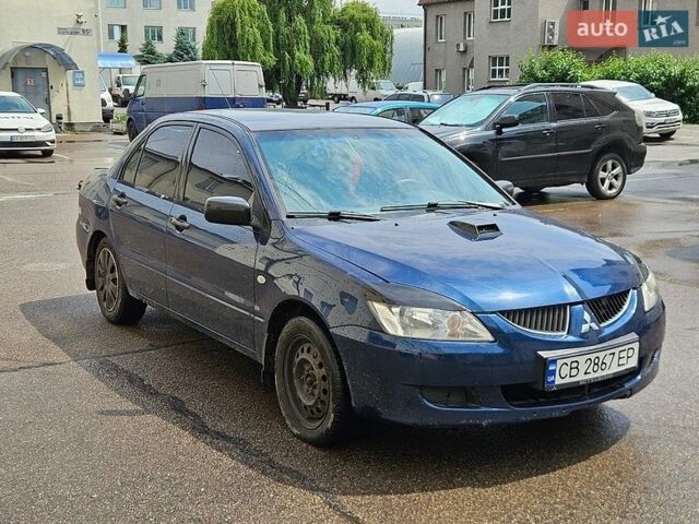 Синій Міцубісі Lancer, об'ємом двигуна 1.58 л та пробігом 250 тис. км за 1950 $, фото 1 на Automoto.ua