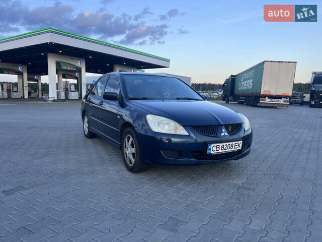 Синий Мицубиси Лансер, объемом двигателя 1.3 л и пробегом 290 тыс. км за 2999 $, фото 1 на Automoto.ua