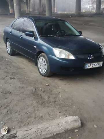 Синий Мицубиси Лансер, объемом двигателя 1.58 л и пробегом 358 тыс. км за 3500 $, фото 1 на Automoto.ua