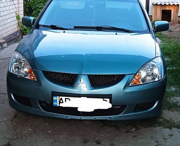 Синий Мицубиси Лансер, объемом двигателя 0 л и пробегом 243 тыс. км за 4300 $, фото 1 на Automoto.ua