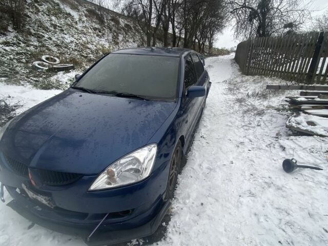 Синий Мицубиси Лансер, объемом двигателя 2 л и пробегом 320 тыс. км за 2700 $, фото 1 на Automoto.ua