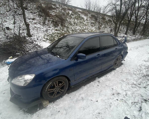 Синій Міцубісі Lancer, об'ємом двигуна 2 л та пробігом 320 тис. км за 2700 $, фото 1 на Automoto.ua