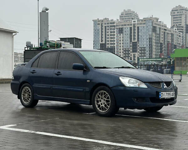 Синій Міцубісі Lancer, об'ємом двигуна 2 л та пробігом 335 тис. км за 4200 $, фото 1 на Automoto.ua