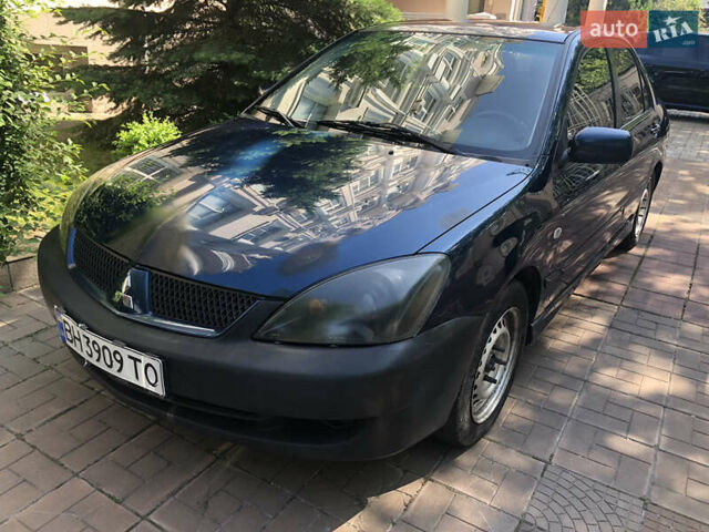 Синий Мицубиси Лансер, объемом двигателя 1.6 л и пробегом 235 тыс. км за 3500 $, фото 1 на Automoto.ua