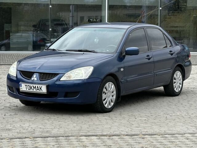 Синий Мицубиси Лансер, объемом двигателя 1.6 л и пробегом 252 тыс. км за 3450 $, фото 1 на Automoto.ua