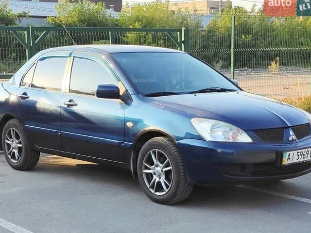 Синий Мицубиси Лансер, объемом двигателя 1.58 л и пробегом 179 тыс. км за 2600 $, фото 1 на Automoto.ua