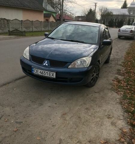 Синий Мицубиси Лансер, объемом двигателя 1.3 л и пробегом 265 тыс. км за 2900 $, фото 1 на Automoto.ua