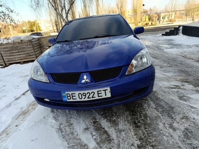Синий Мицубиси Лансер, объемом двигателя 1.6 л и пробегом 300 тыс. км за 3000 $, фото 1 на Automoto.ua