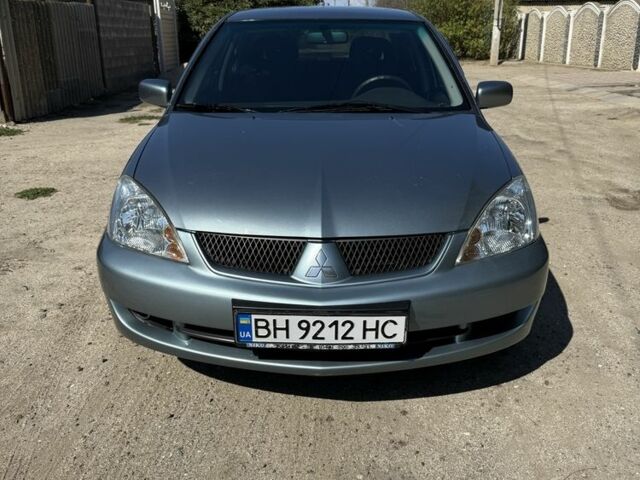 Синій Міцубісі Lancer, об'ємом двигуна 1.6 л та пробігом 244 тис. км за 4709 $, фото 1 на Automoto.ua