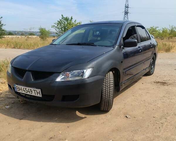 Синий Мицубиси Лансер, объемом двигателя 1.6 л и пробегом 360 тыс. км за 3000 $, фото 1 на Automoto.ua