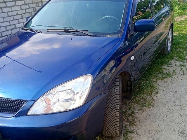 Синий Мицубиси Лансер, объемом двигателя 1.6 л и пробегом 305 тыс. км за 3500 $, фото 1 на Automoto.ua