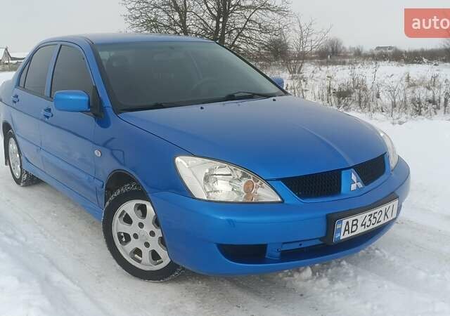 Синий Мицубиси Лансер, объемом двигателя 1.58 л и пробегом 155 тыс. км за 5100 $, фото 1 на Automoto.ua