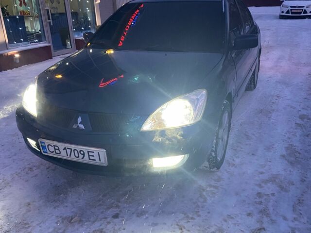 Синий Мицубиси Лансер, объемом двигателя 1.6 л и пробегом 380 тыс. км за 4500 $, фото 1 на Automoto.ua