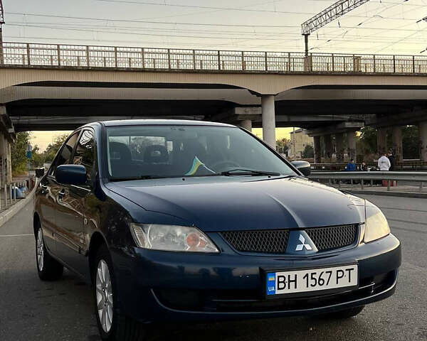 Синий Мицубиси Лансер, объемом двигателя 1.6 л и пробегом 350 тыс. км за 4200 $, фото 1 на Automoto.ua