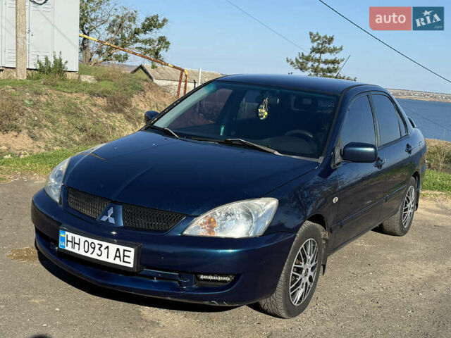 Синій Міцубісі Lancer, об'ємом двигуна 1.58 л та пробігом 269 тис. км за 3350 $, фото 1 на Automoto.ua