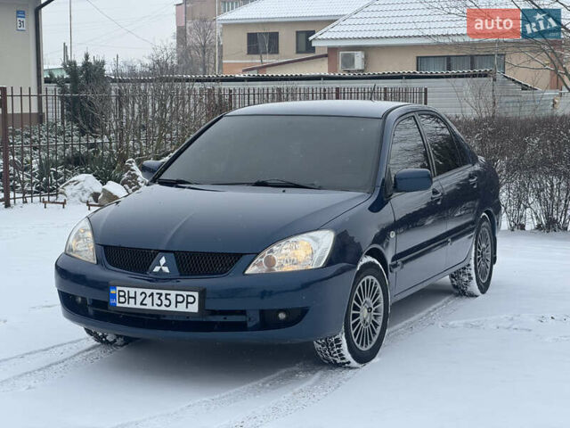 Синий Мицубиси Лансер, объемом двигателя 1.58 л и пробегом 293 тыс. км за 4799 $, фото 1 на Automoto.ua