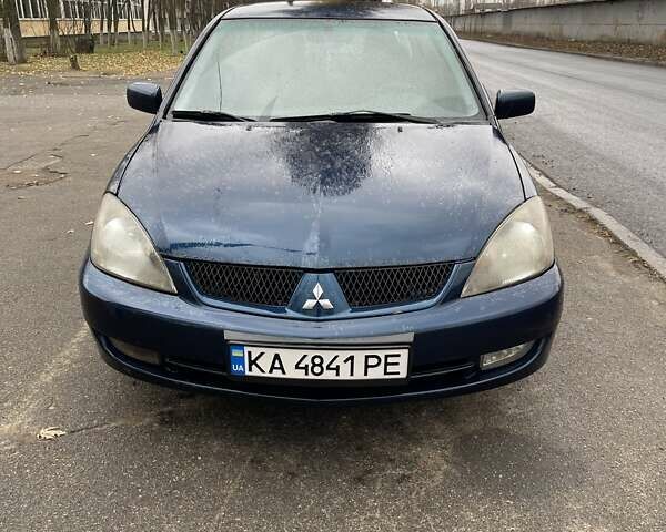 Синій Міцубісі Lancer, об'ємом двигуна 2 л та пробігом 430 тис. км за 4200 $, фото 1 на Automoto.ua