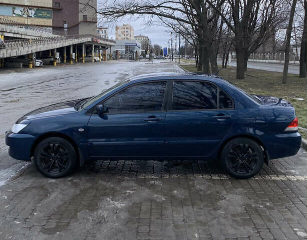 Синий Мицубиси Лансер, объемом двигателя 1.6 л и пробегом 270 тыс. км за 4599 $, фото 1 на Automoto.ua