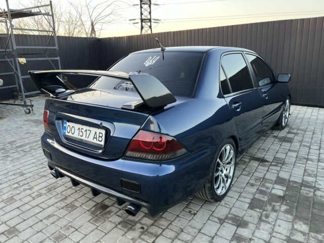 Синій Міцубісі Lancer, об'ємом двигуна 1.6 л та пробігом 241 тис. км за 5500 $, фото 1 на Automoto.ua