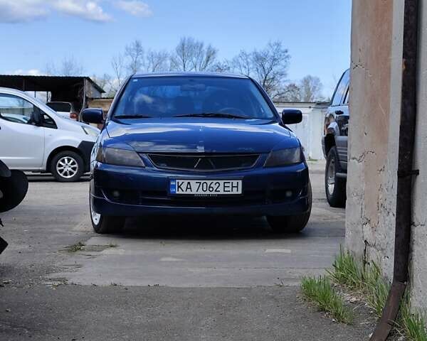 Синий Мицубиси Лансер, объемом двигателя 2 л и пробегом 7 тыс. км за 5100 $, фото 1 на Automoto.ua