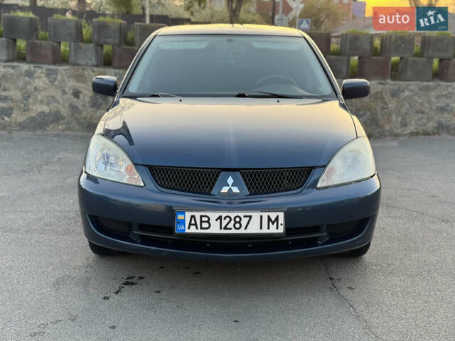 Синий Мицубиси Лансер, объемом двигателя 1.58 л и пробегом 300 тыс. км за 3650 $, фото 1 на Automoto.ua