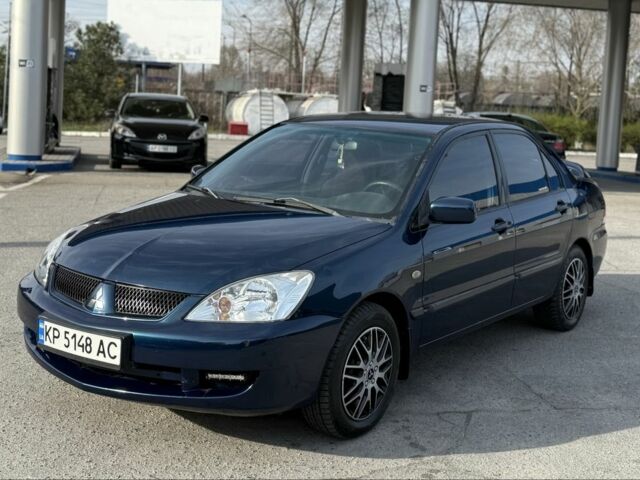 Синий Мицубиси Лансер, объемом двигателя 1.6 л и пробегом 270 тыс. км за 3600 $, фото 1 на Automoto.ua