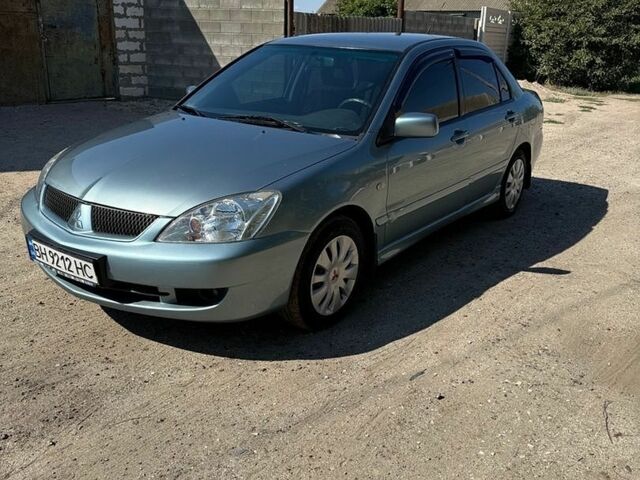 Синій Міцубісі Lancer, об'ємом двигуна 1.6 л та пробігом 244 тис. км за 4700 $, фото 1 на Automoto.ua