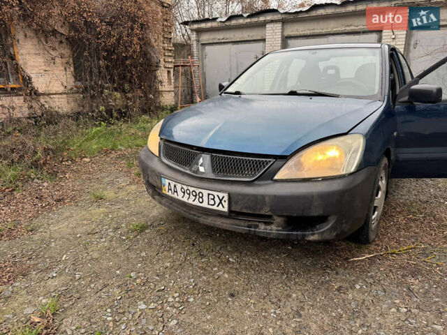 Синий Мицубиси Лансер, объемом двигателя 1.58 л и пробегом 243 тыс. км за 2900 $, фото 1 на Automoto.ua