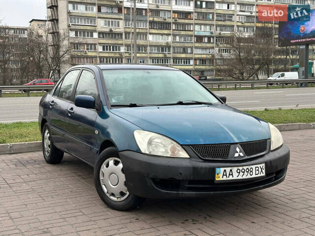 Синий Мицубиси Лансер, объемом двигателя 1.58 л и пробегом 260 тыс. км за 2300 $, фото 1 на Automoto.ua