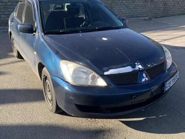 Синій Міцубісі Lancer, об'ємом двигуна 1.6 л та пробігом 242 тис. км за 2100 $, фото 1 на Automoto.ua