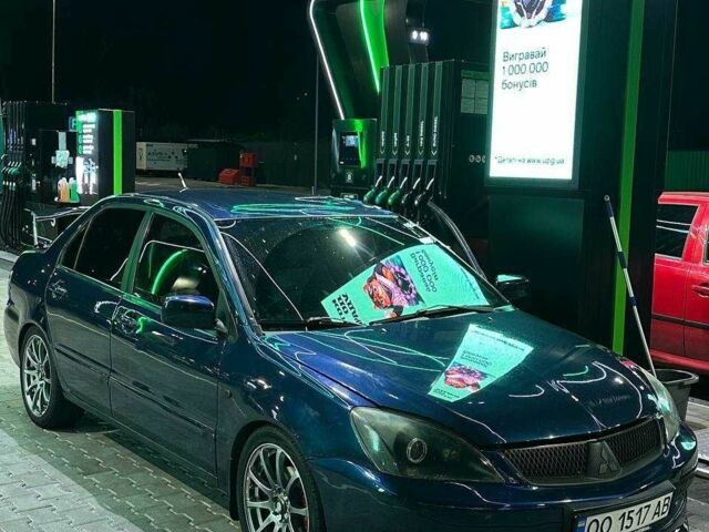 Синий Мицубиси Лансер, объемом двигателя 1.6 л и пробегом 241 тыс. км за 4995 $, фото 1 на Automoto.ua