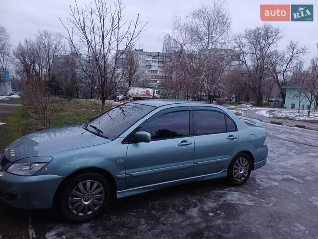 Синий Мицубиси Лансер, объемом двигателя 1.6 л и пробегом 230 тыс. км за 4600 $, фото 1 на Automoto.ua