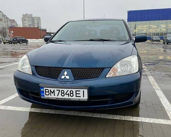 Синий Мицубиси Лансер, объемом двигателя 1.58 л и пробегом 180 тыс. км за 4500 $, фото 1 на Automoto.ua