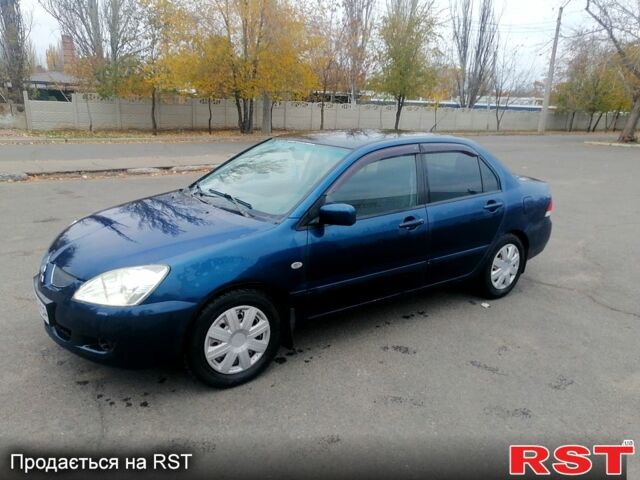 Синий Мицубиси Лансер, объемом двигателя 1.6 л и пробегом 258 тыс. км за 3400 $, фото 1 на Automoto.ua