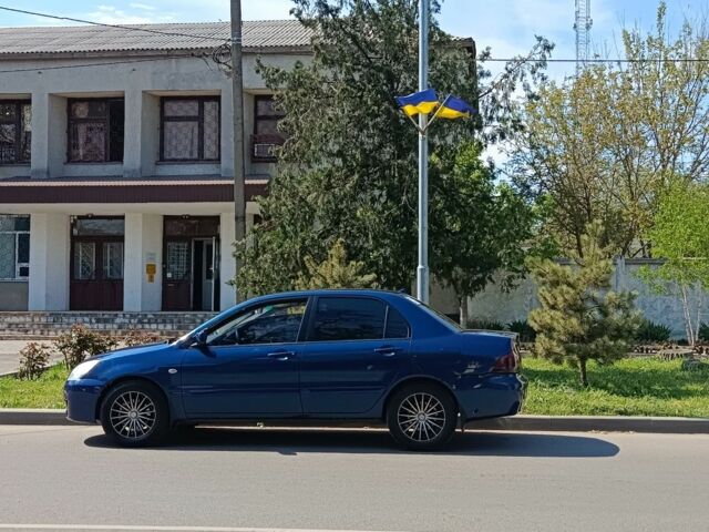 Синий Мицубиси Лансер, объемом двигателя 1.6 л и пробегом 300 тыс. км за 4200 $, фото 1 на Automoto.ua