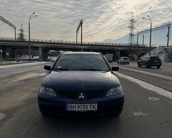 Синій Міцубісі Lancer, об'ємом двигуна 1.58 л та пробігом 211 тис. км за 5000 $, фото 1 на Automoto.ua