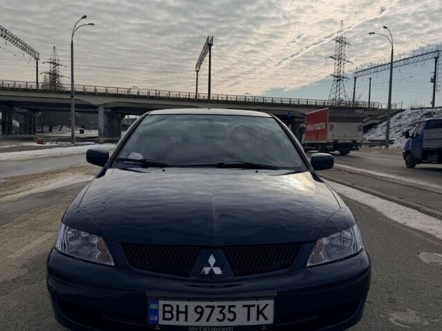 Синий Мицубиси Лансер, объемом двигателя 1.6 л и пробегом 211 тыс. км за 5000 $, фото 1 на Automoto.ua