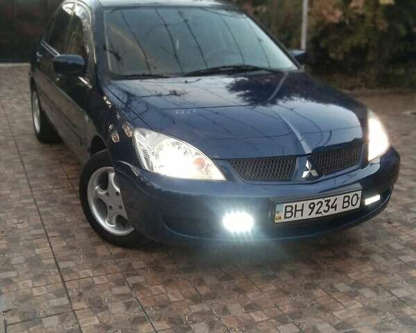 Синий Мицубиси Лансер, объемом двигателя 1.58 л и пробегом 195 тыс. км за 3990 $, фото 1 на Automoto.ua