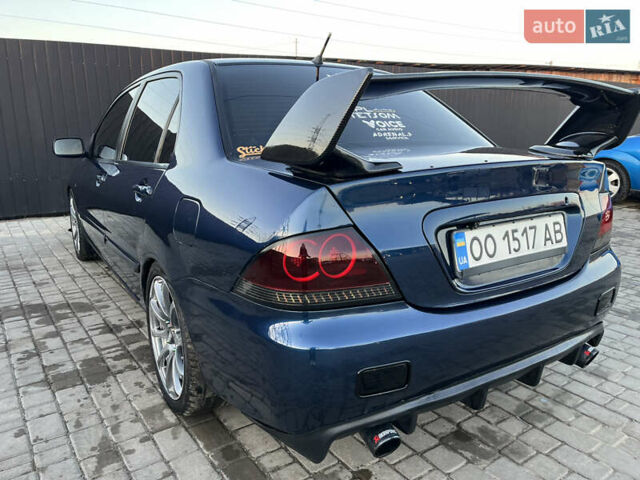 Синій Міцубісі Lancer, об'ємом двигуна 2 л та пробігом 240 тис. км за 5500 $, фото 1 на Automoto.ua