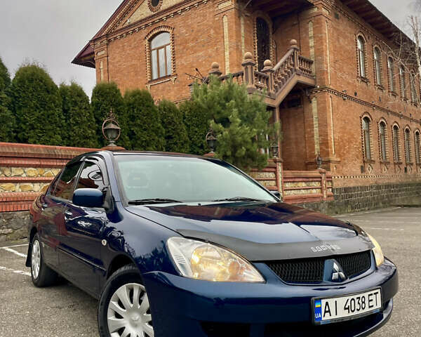 Синий Мицубиси Лансер, объемом двигателя 1.6 л и пробегом 185 тыс. км за 4950 $, фото 1 на Automoto.ua