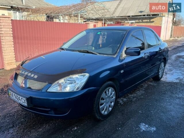 Синий Мицубиси Лансер, объемом двигателя 1.6 л и пробегом 269 тыс. км за 4200 $, фото 1 на Automoto.ua