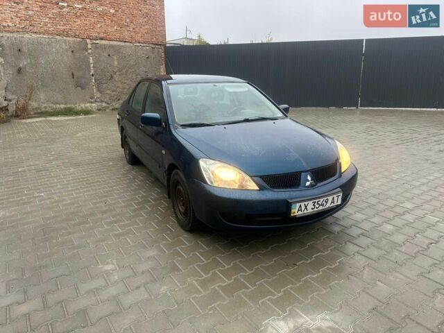 Синій Міцубісі Lancer, об'ємом двигуна 1.58 л та пробігом 170 тис. км за 1900 $, фото 1 на Automoto.ua